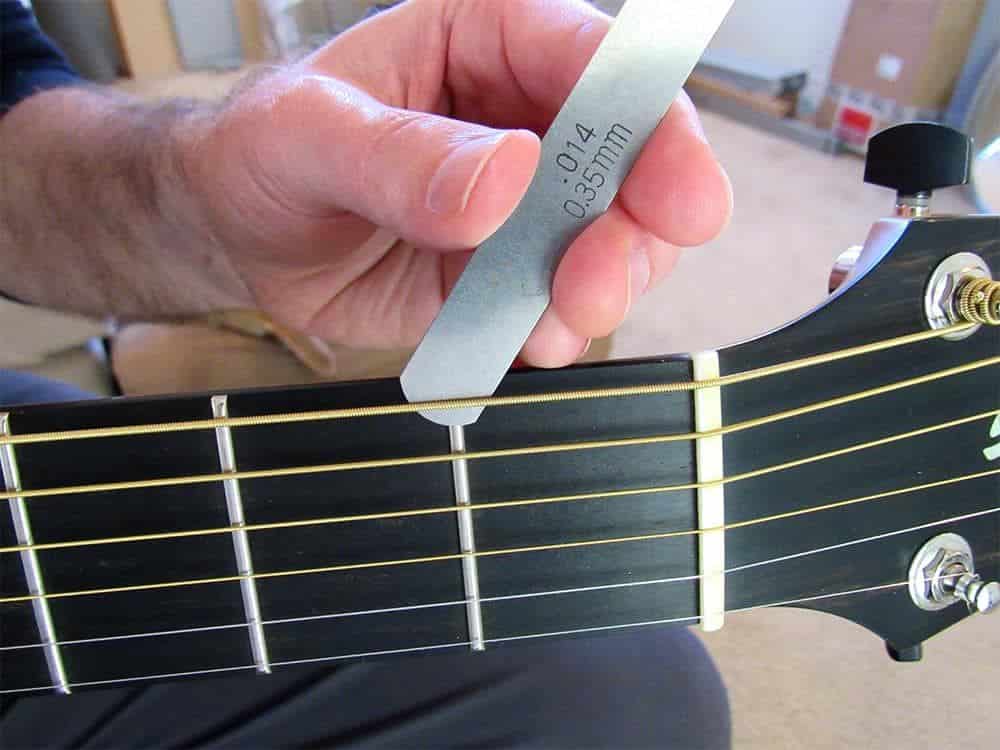 MEASURE THE ACTION AT THE FIRST FRET