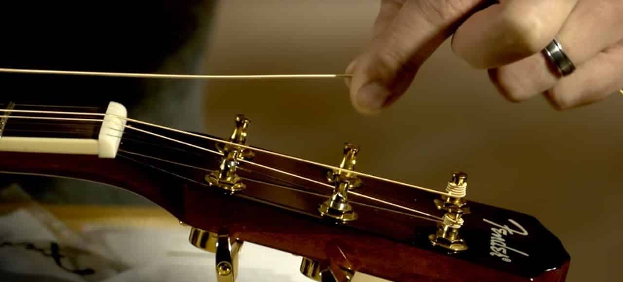 how to restring an acoustic guitar